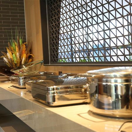 Qiu Guo Hotel Hua Mao Chaoyang  المظهر الخارجي الصورة